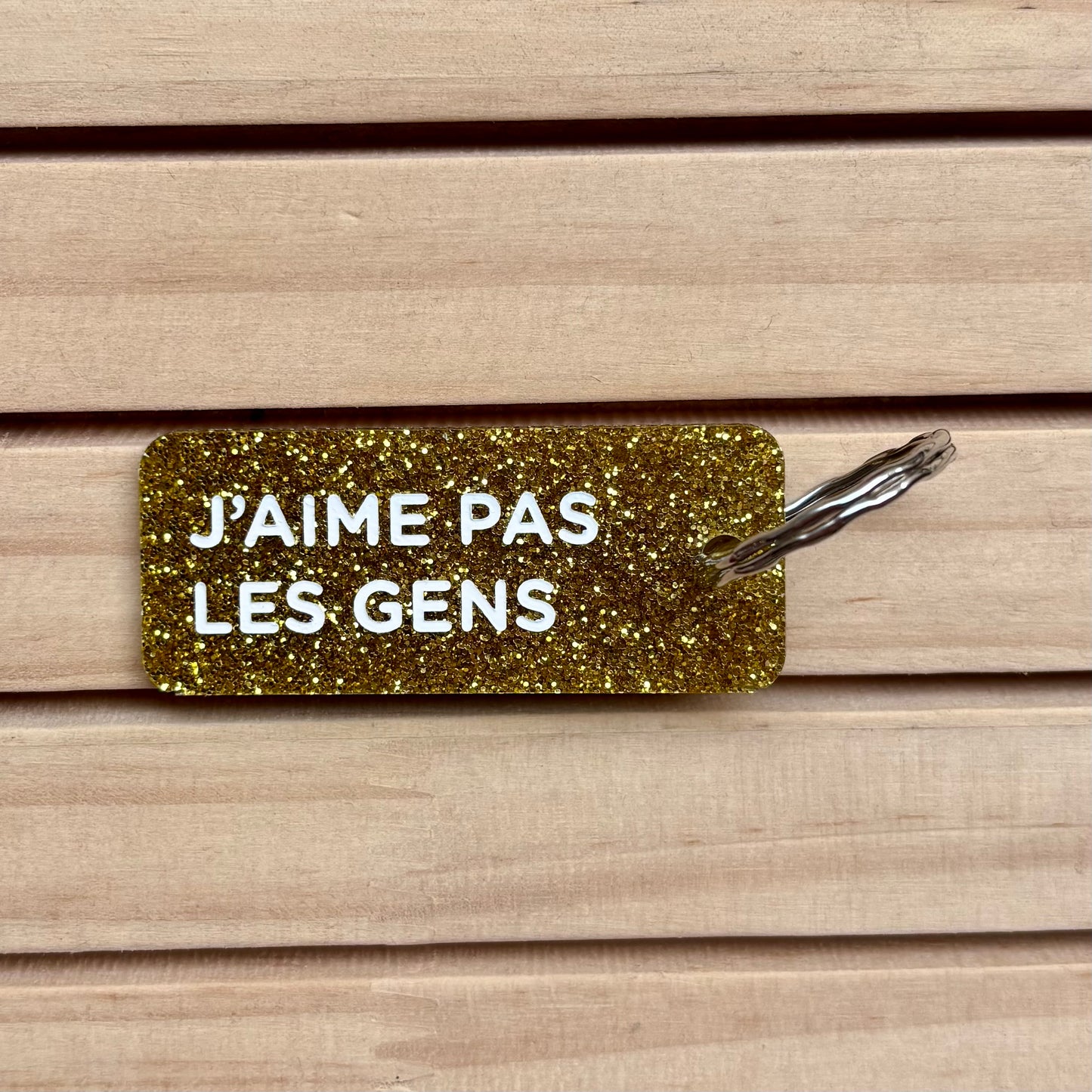 Porte-clés J’aime pas les gens (couleur or)