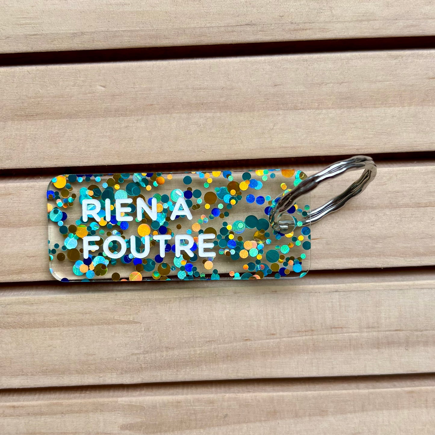 Porte-clés Rien à foutre bleu/or/vert