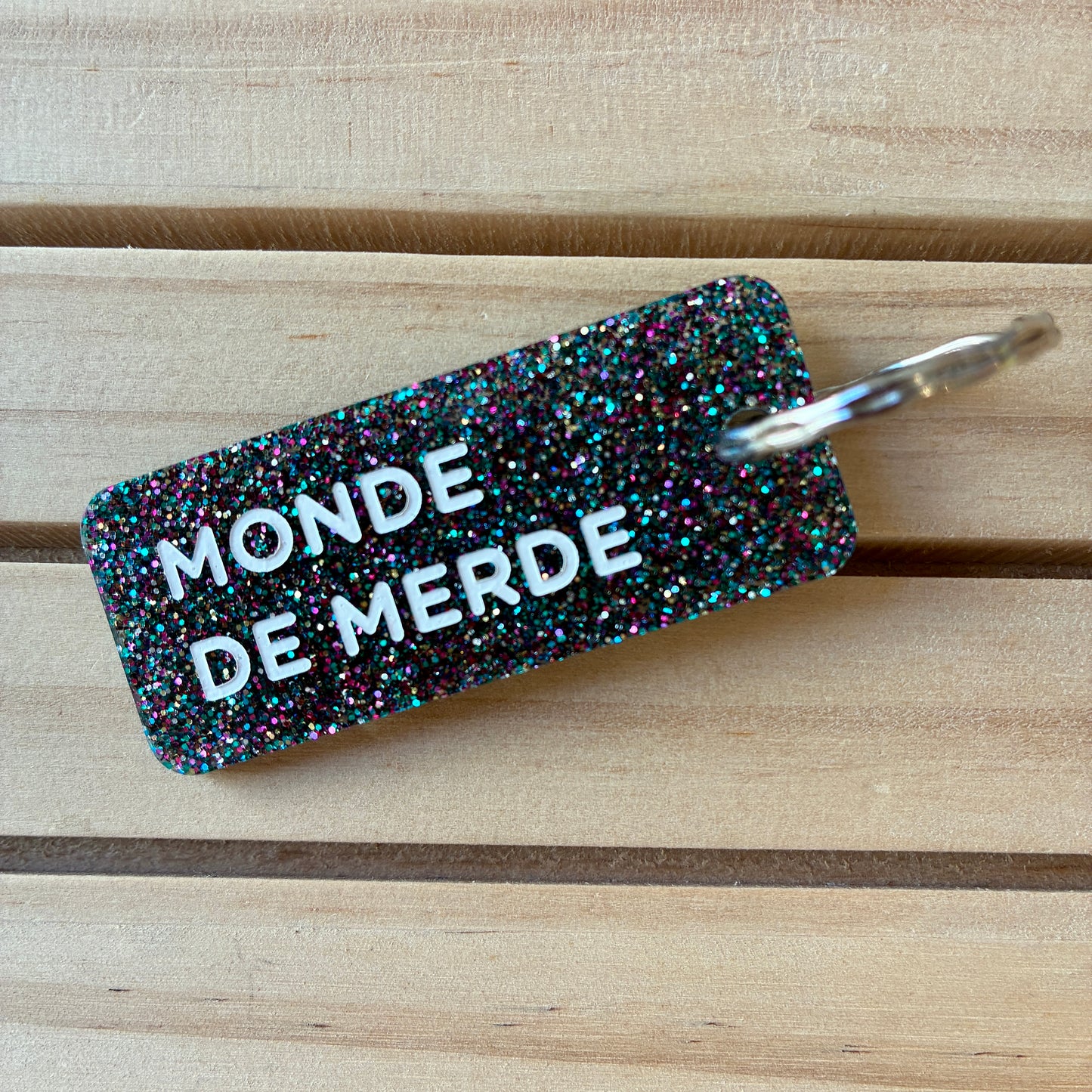 Porte-clés Monde de merde