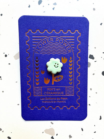 Pin’s en céramique fleur smiley vert pastel