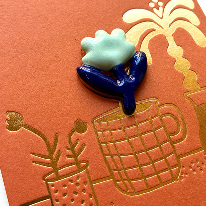 Pin’s en céramique fleur bleu nuit et vert d’eau