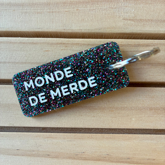 Porte-clés Monde de merde