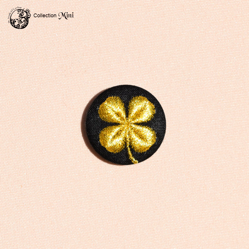 Broche Mini trèfle noir et doré